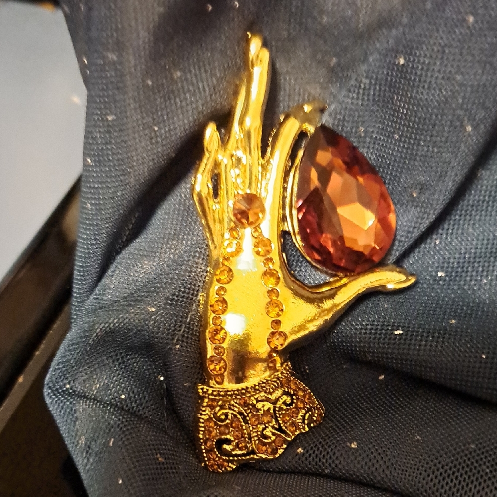 Gold Hand Brooch with Brown Gem